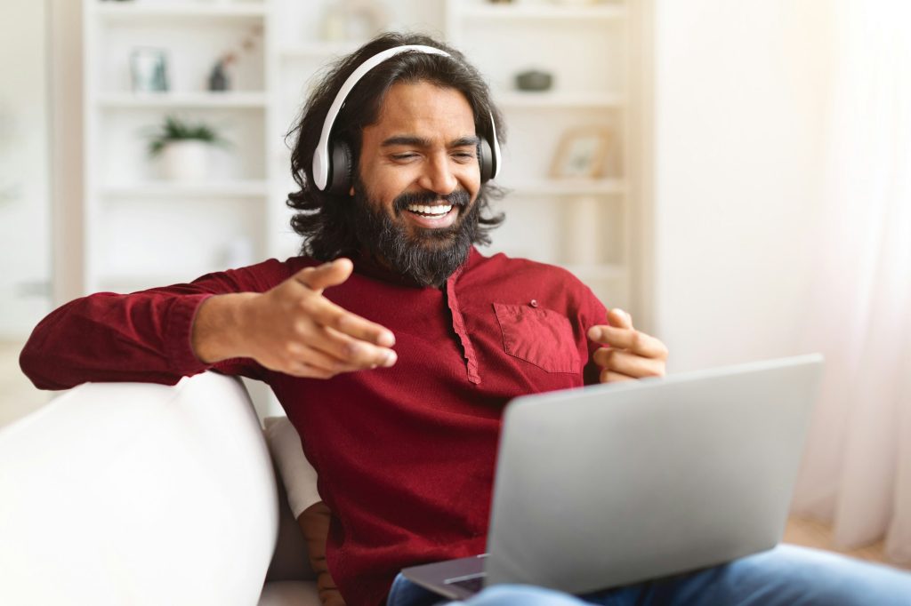 Handsome millennial indian man project manager working from home